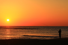 釣り人と夕日