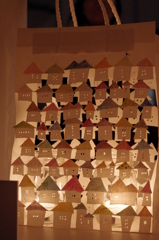 mini houses in a paper bag