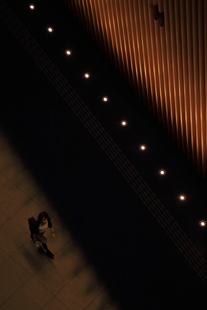 Woman walking along the wall