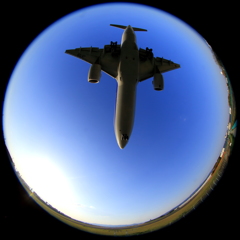 Plane in the bright blue sky