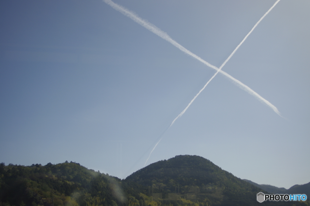 車窓から見る飛行機雲X