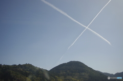 車窓から見る飛行機雲X
