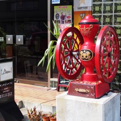 Cafe entrance with coffee mill 