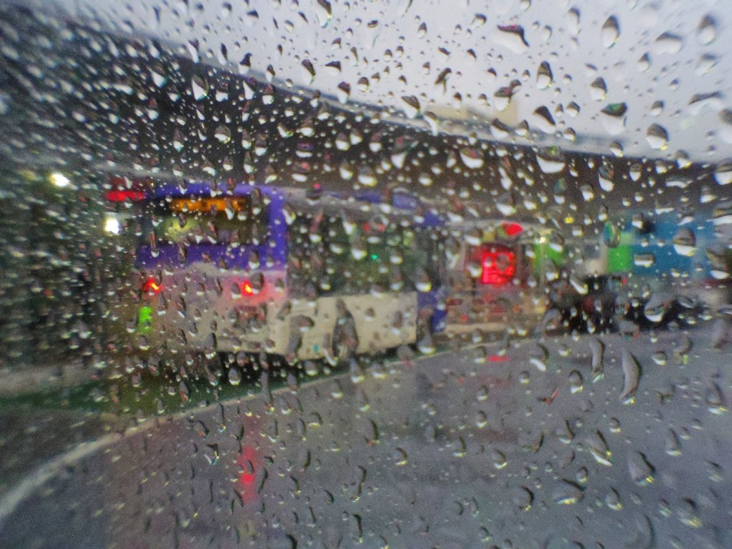 Bus terminal in rain
