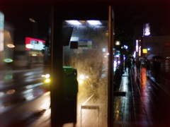 Telephone booth in rain