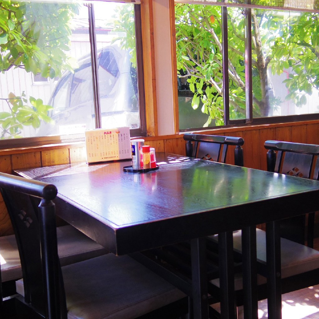 Wooden table and chairs with sunlight