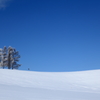 blue sky white hill