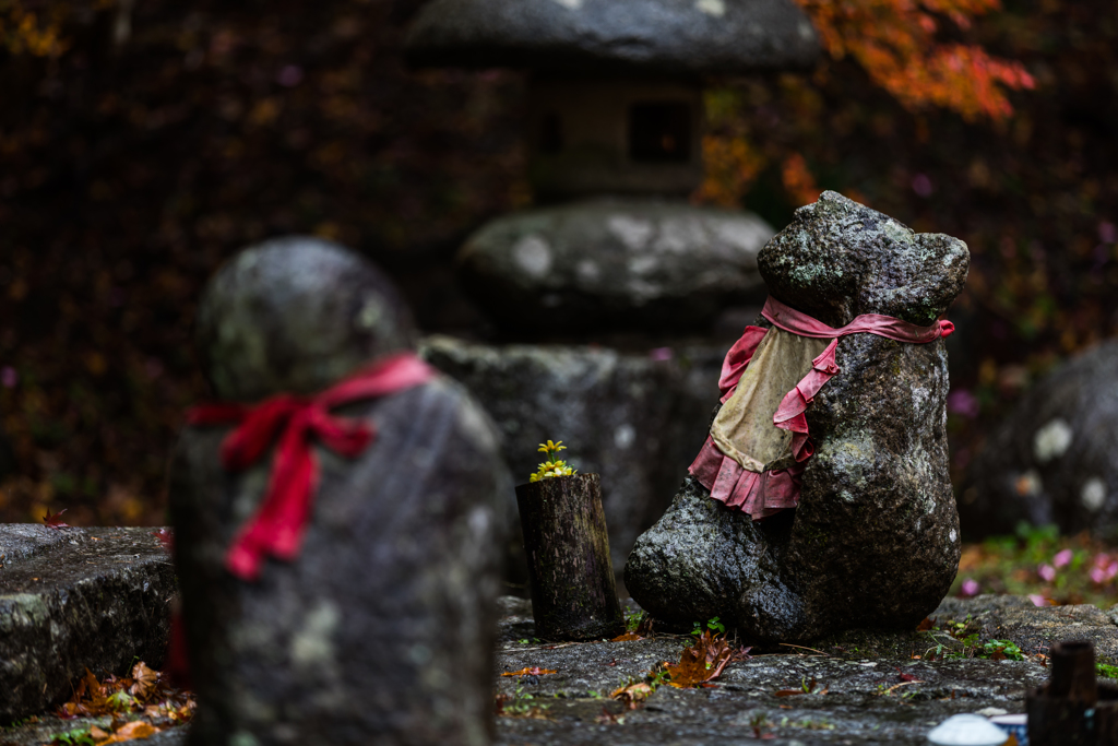 A stone statue getting wet with rain