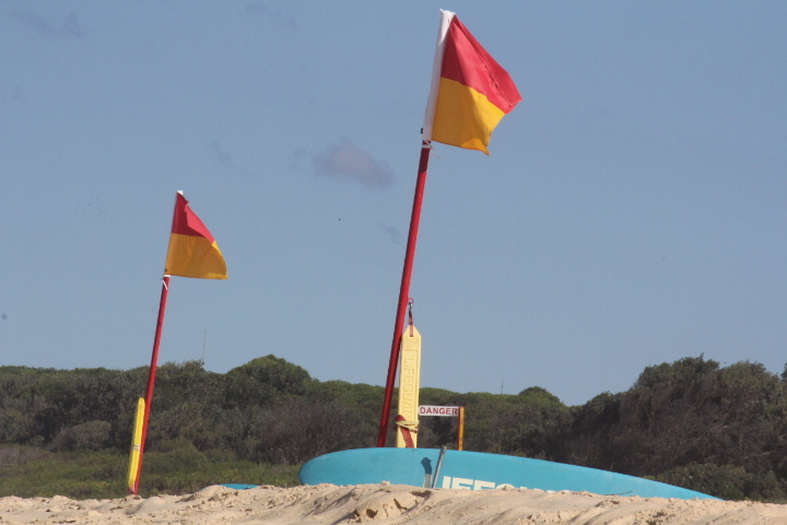 between the flags