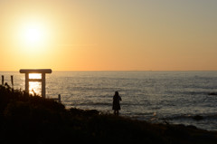 夕日の写真を撮るひと