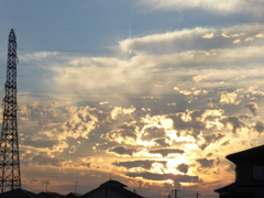 夕日と旅客機と鉄塔と