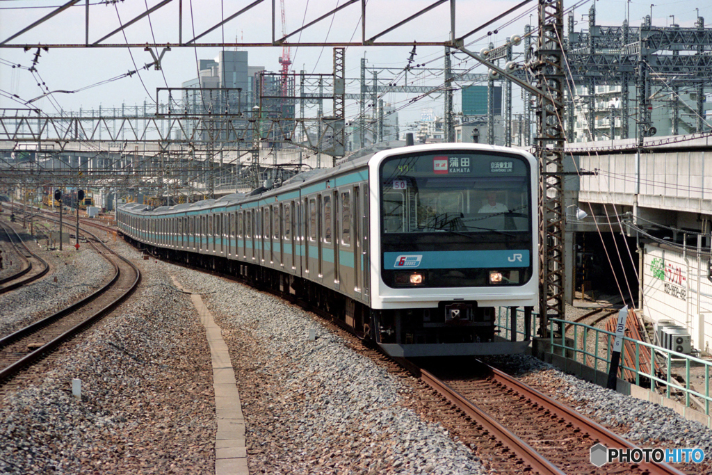 西日暮里駅に進入する209系