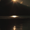 徐々に沈んでいく太陽と富士山