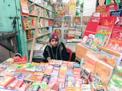 a boy selling books