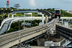 a mono-rail train and a car