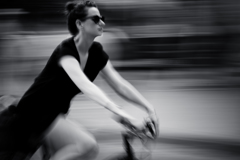 a beautiful women rinding a bike