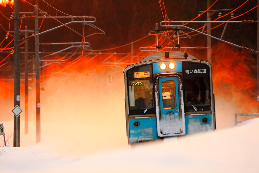 燃える雪煙
