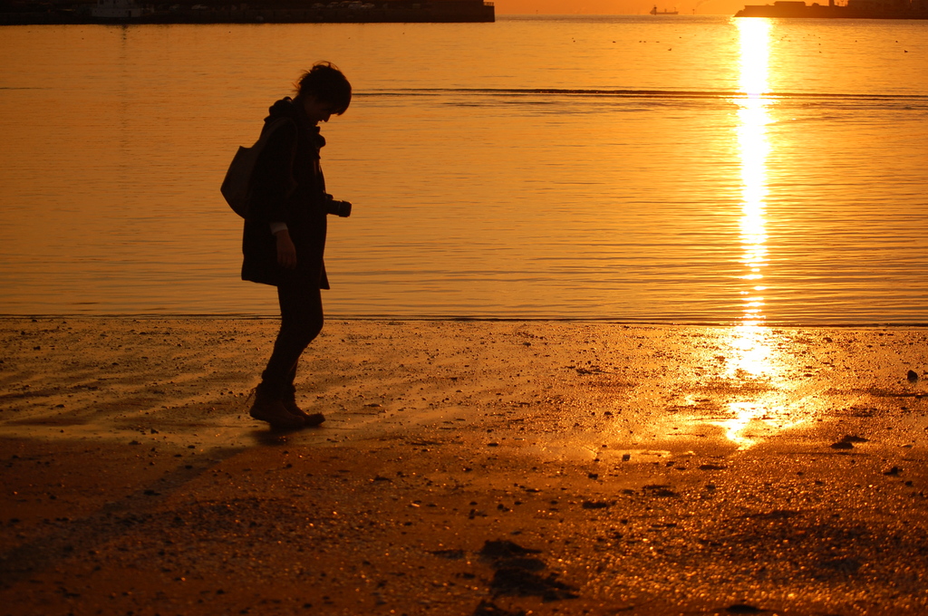 a woman in the sunset