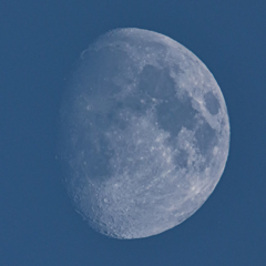 The moon in the blue sky