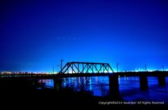 An iron bridge and night view