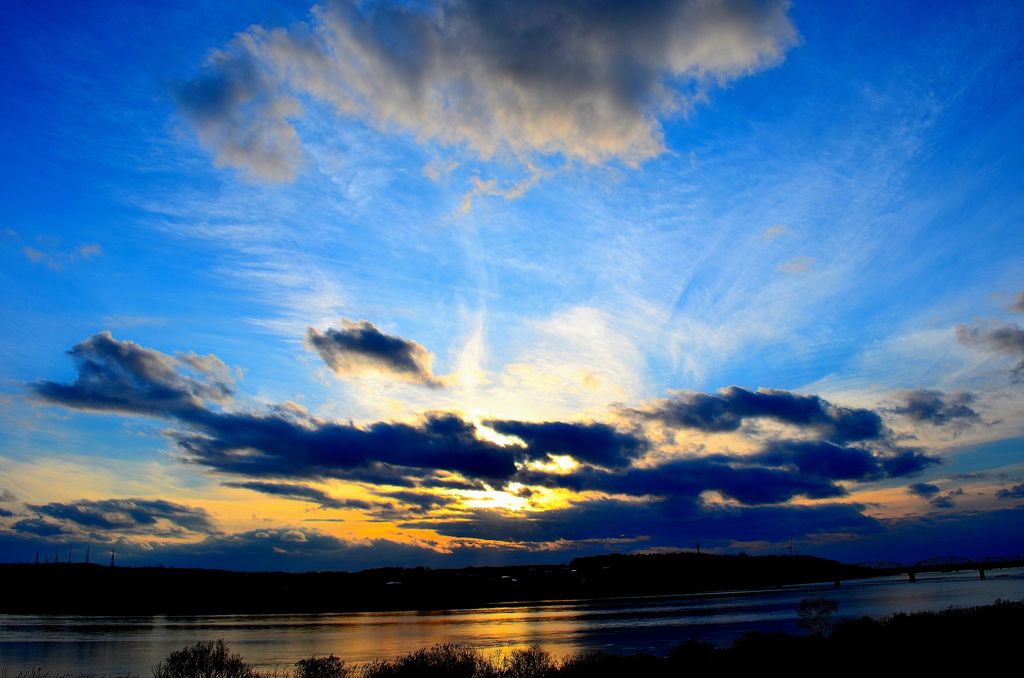 The setting sun wrapped in the blue sky 