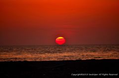 The setting sun which sinks