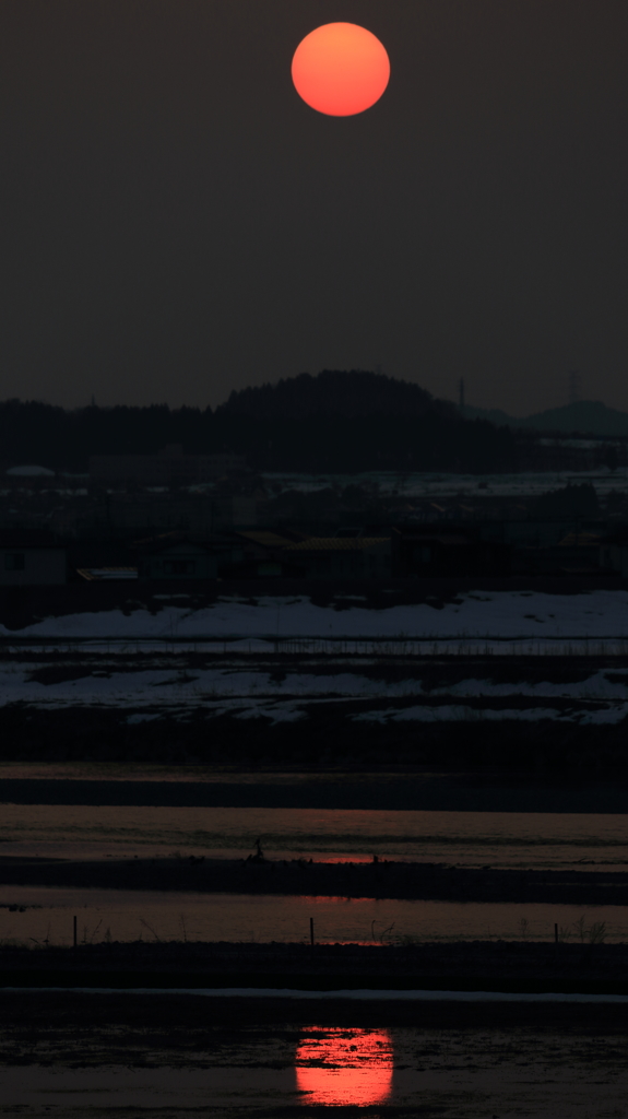 信濃川に溶け込む夕日