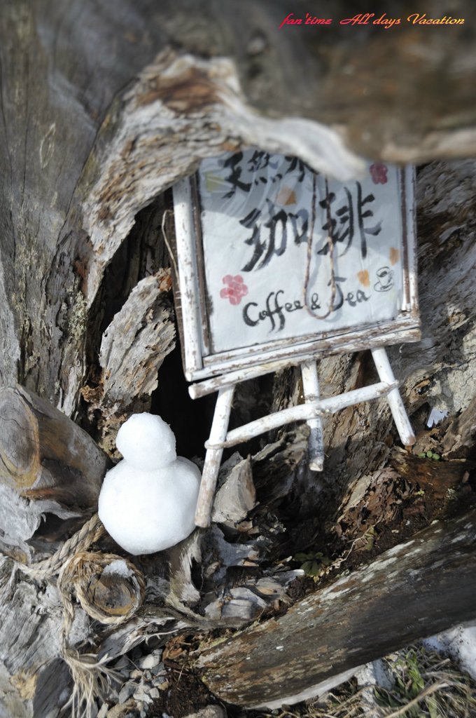 雪だるまと看板