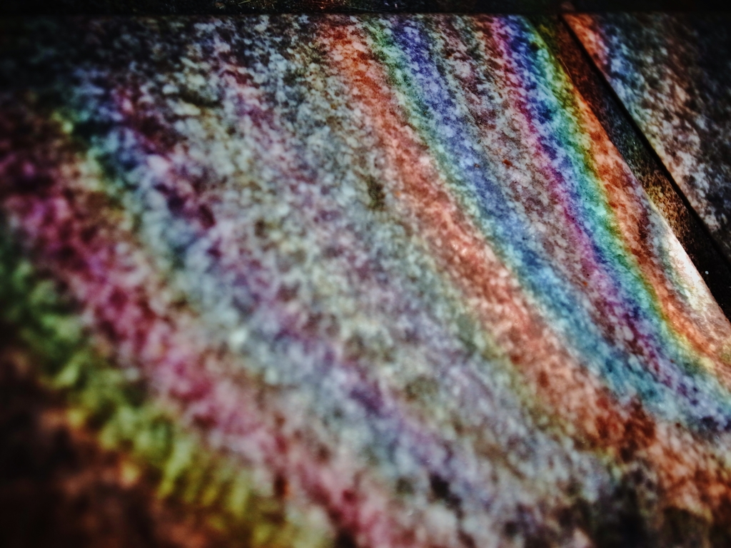 The wall reflected in a rainbow.