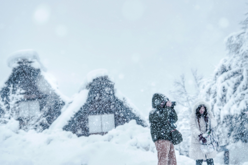 雪のカメラマン