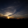 夕日と虹と飛行機雲