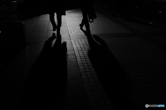 Two men walking in midnight