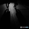 Two men walking in midnight