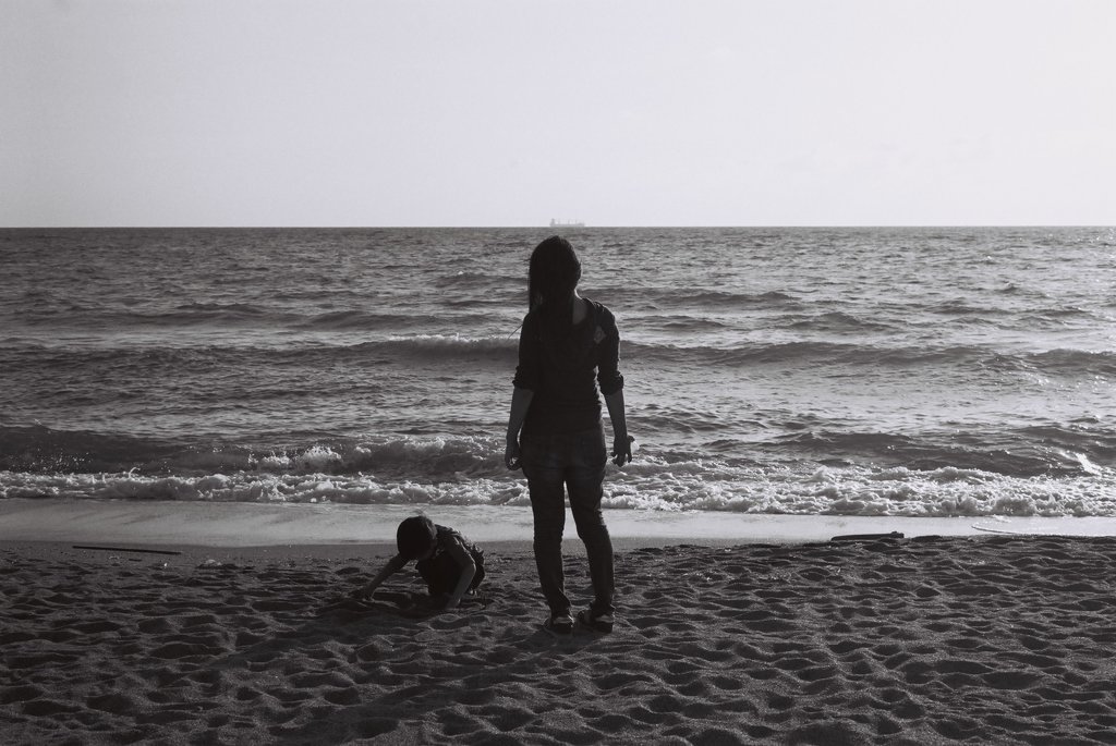 Parent and child on the sand