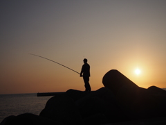 A sunset and angler
