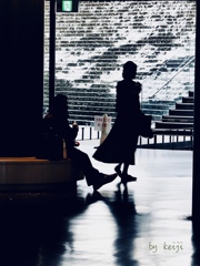 A woman facing the waves