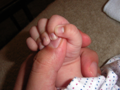 baby "grasp" dad's finger