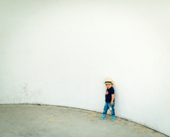 A son and white wall