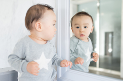 Son reflection in mirror