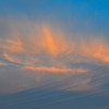 夕日と雲で作られた橙糸