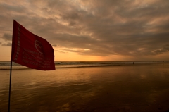 Red Flag in sunset beach