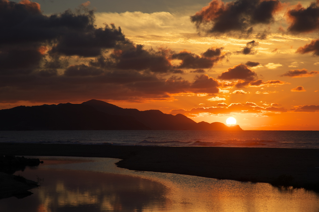 Sunset and shining wave