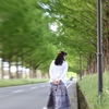 Beautiful woman walking the street trees