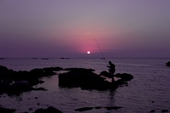 fisherman with sunrise