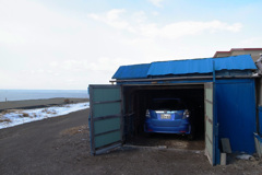 blue car in the blue garage