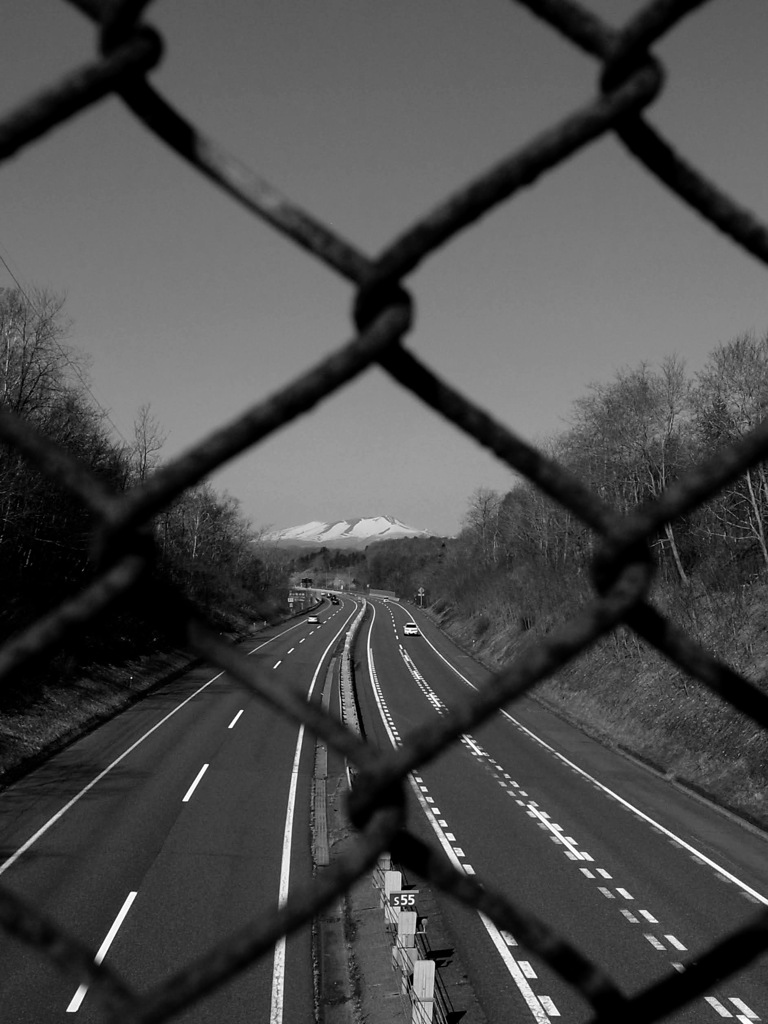 Spring mountain beyond the fence