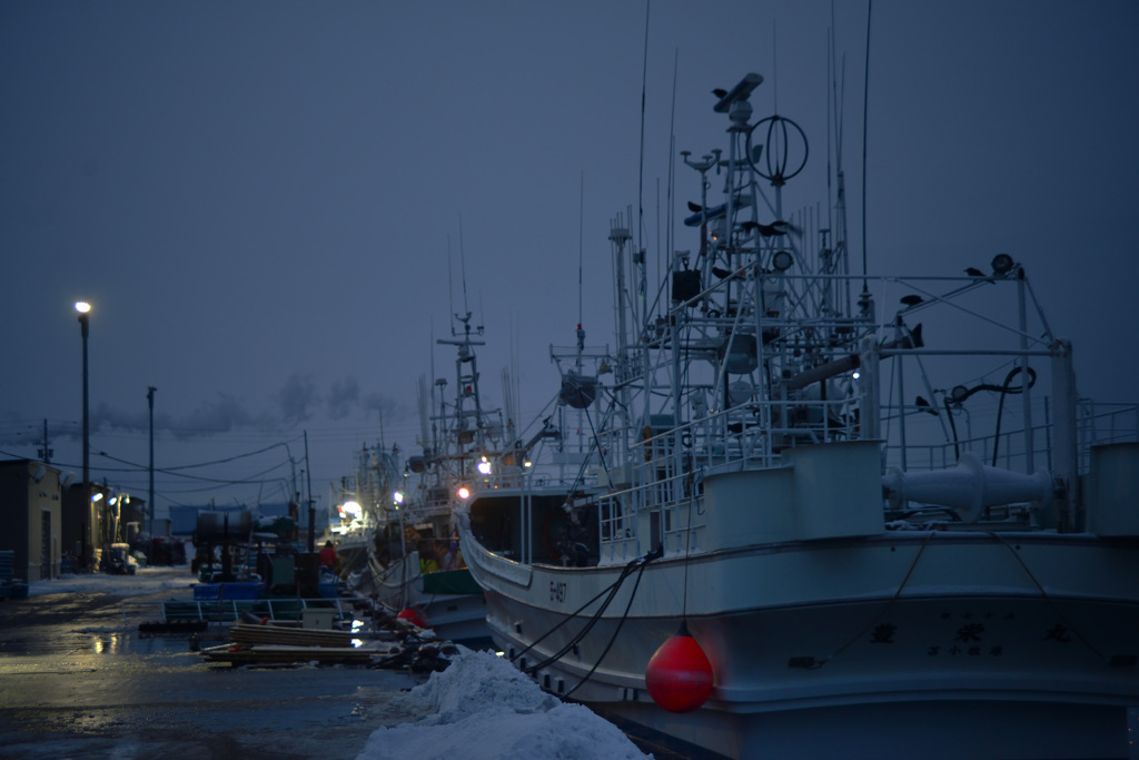 Red fender on fishing boat