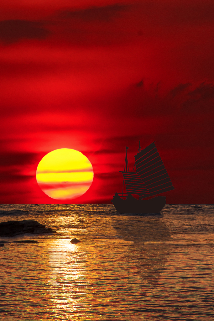 帆船と夕焼けの海