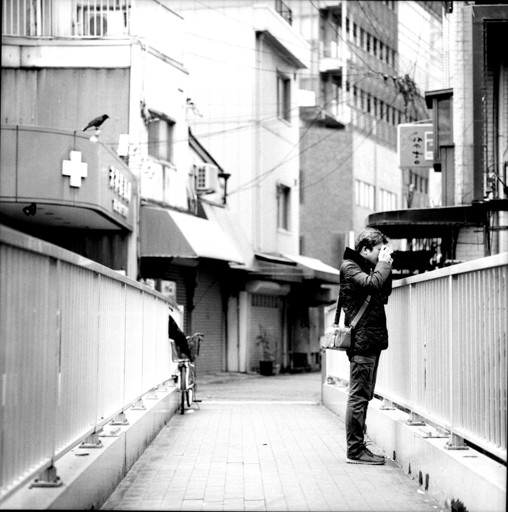 Camera → Man