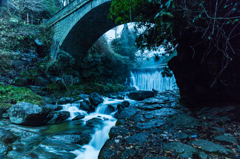 Between the stone bridge and waterfall